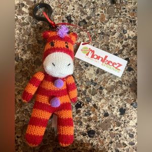 new with tags orange and red striped monkey keychain
